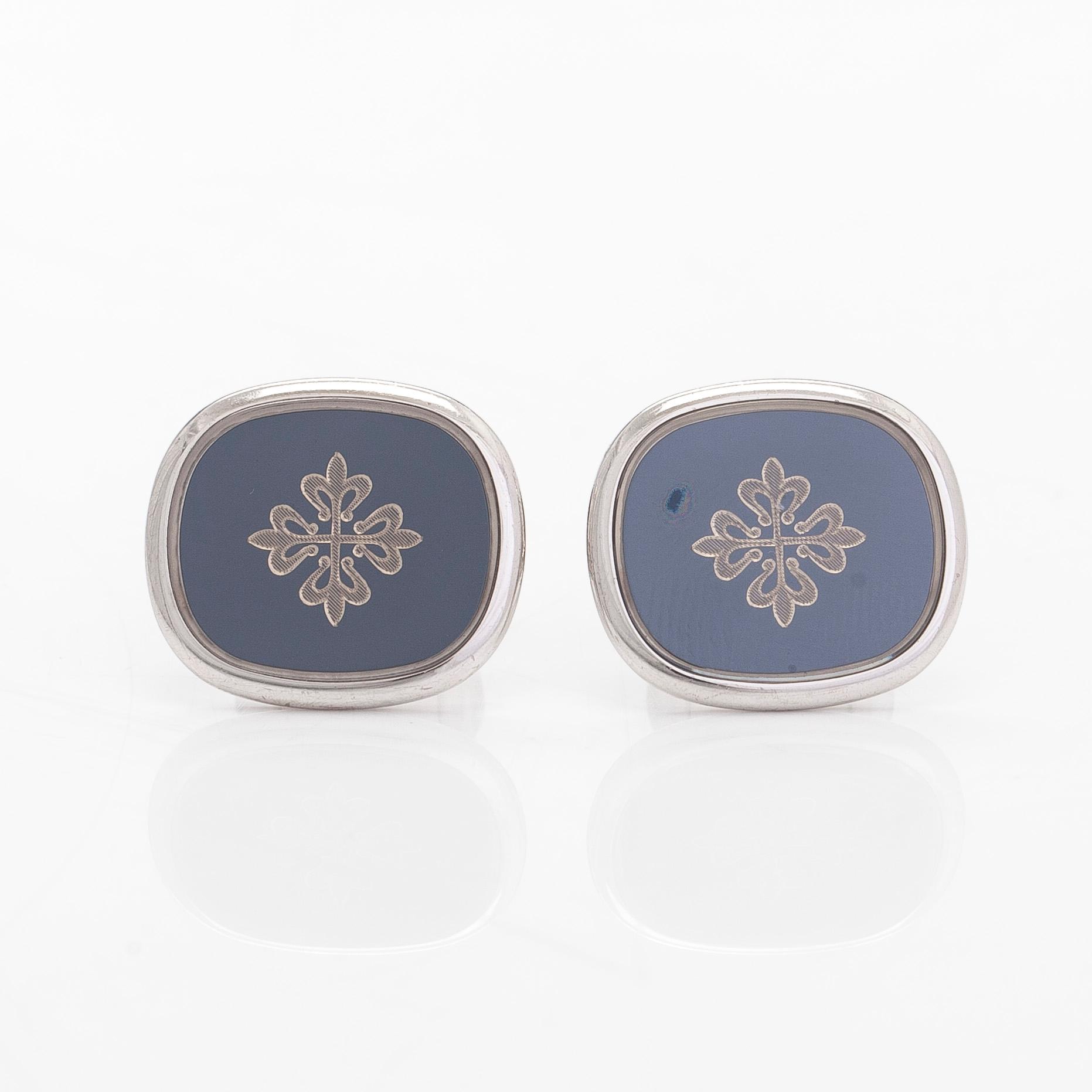 Patek Philippe, a pair of 18K whitegold 'Calatrava' cufflinks.
