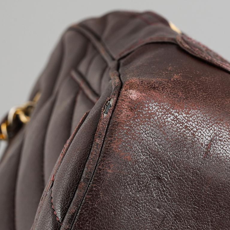 Chanel, a burgundy leather handbag, 1989-91.