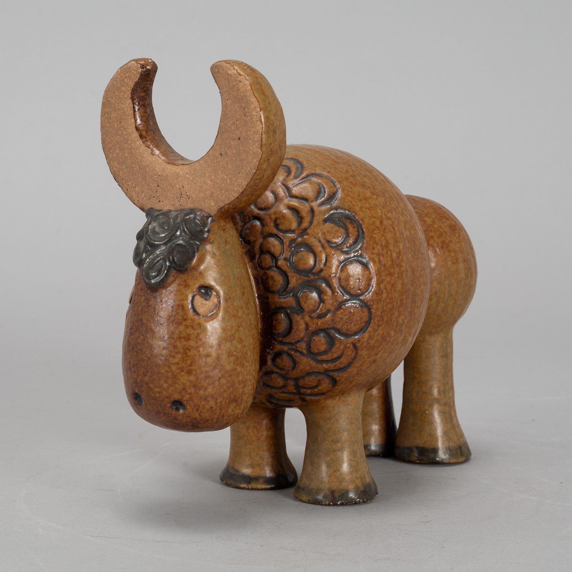 LISA LARSON, a stoneware candelabra and a figurine. Gustavsberg.