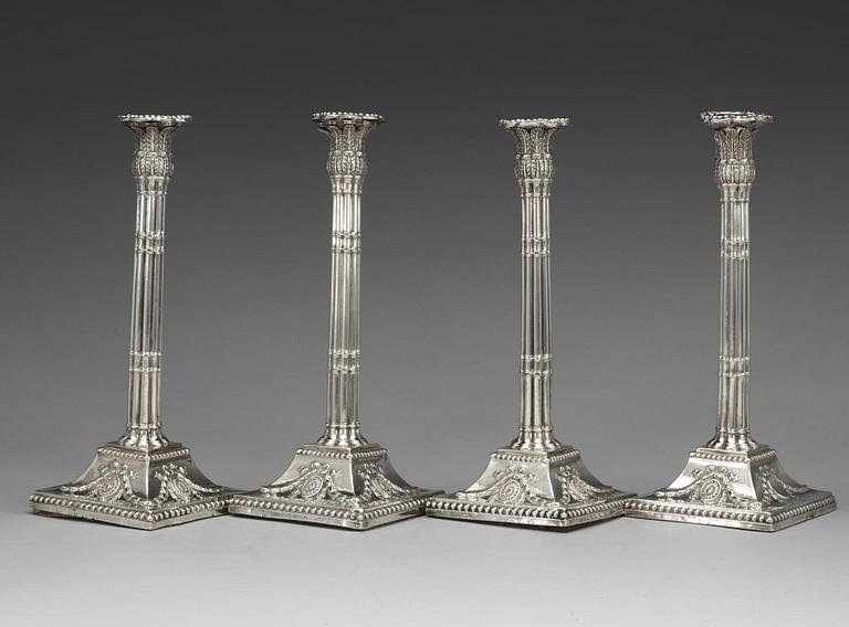 A set of four English silver candlesticks, marks of William Holmes, London 1772.