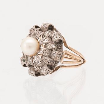 A ring set with a cultured pearl and rose-cut diamonds.