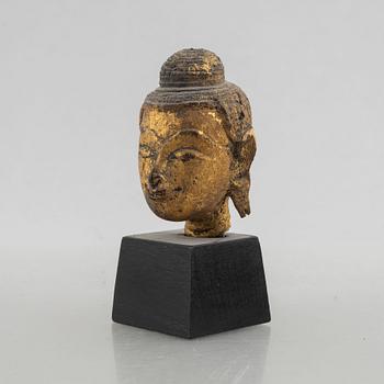 Two Thai gilt wooden fragments of figurines, late 19th century.