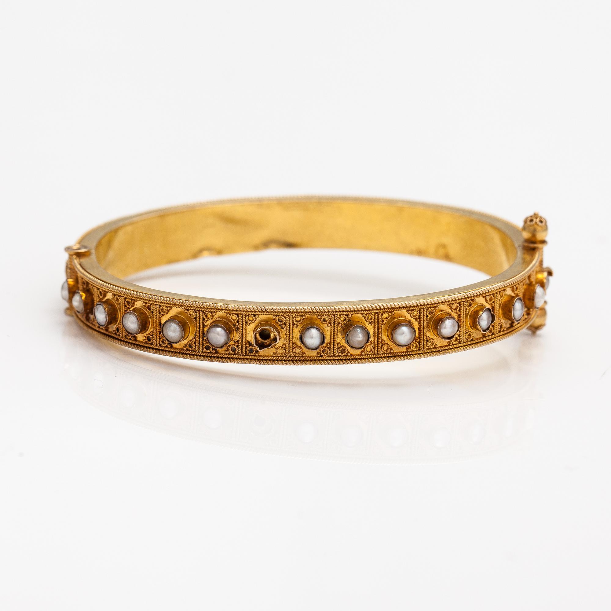 A ca. 22K gold bracelet with sapphires and pearls. Marchesini, Firenze Roma.