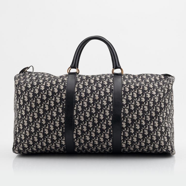 Christian Dior, a canvas weekend bag and umbrella.