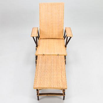 An early 20th century rattan lounge chair/sun chair.