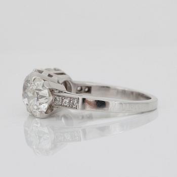 An old-cut three stone diamond ring. Total carat weight circa 3.90 ct.