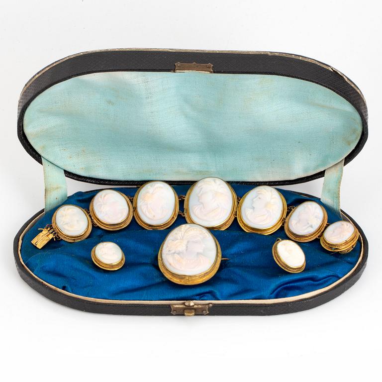 Set with brooch, earrings, bracelet with carved sea shell cameos.