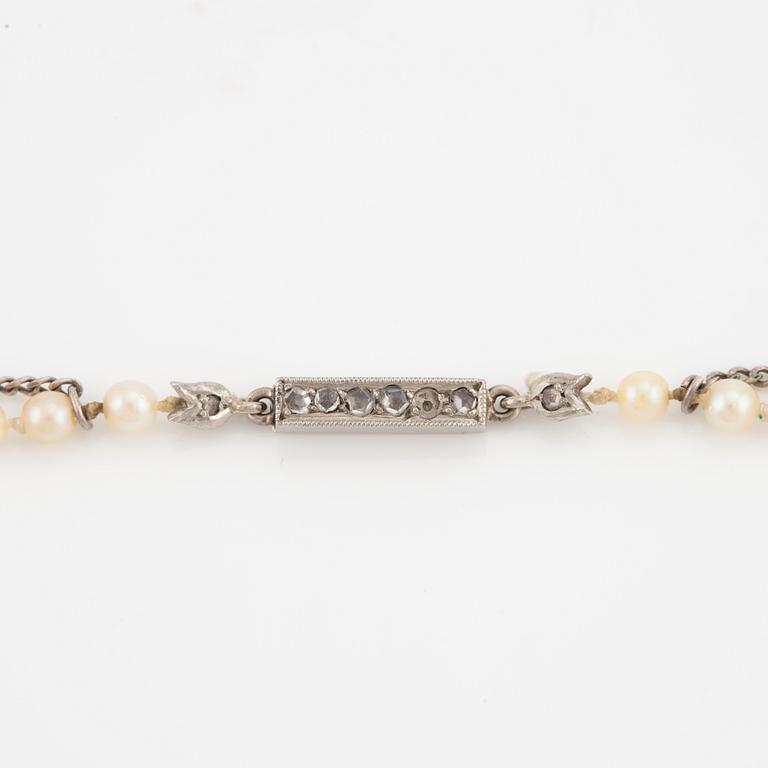 Necklace with cultured graduated pearls, white gold clasp with rose-cut diamonds.