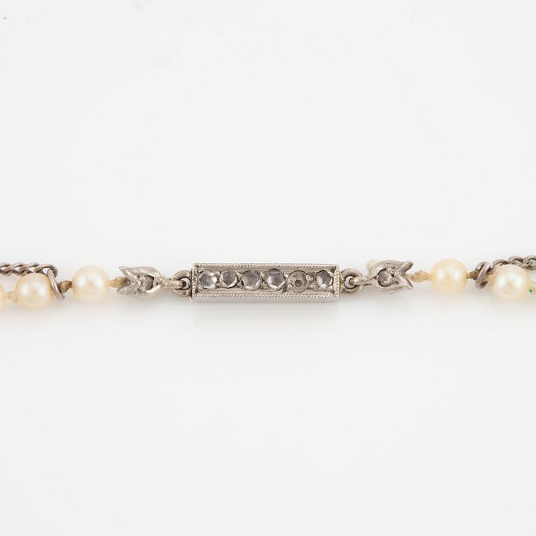 Necklace with cultured graduated pearls, white gold clasp with rose-cut diamonds.