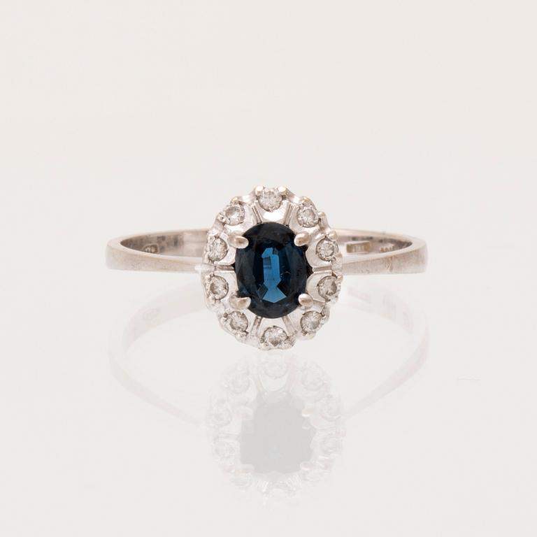 An 18K white gold carmosé ring set with an oval faceted sapphire and round brilliant-cut diamonds, Alessandria Italy.