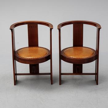 Eliel Saarinen, a pair of 'Hannes'' mahogany armchairs, Adelta Oy, Finland, 1983.