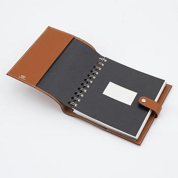 Hermès, a whisky leather notebook/agenda.