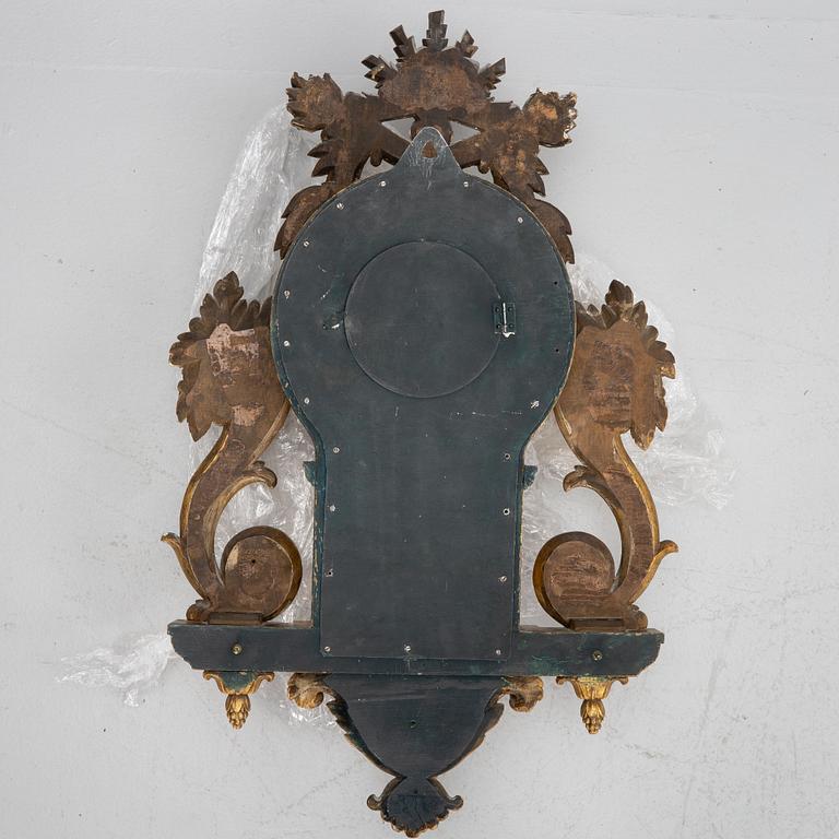 A Gustavian style wall clock, circa 1900.