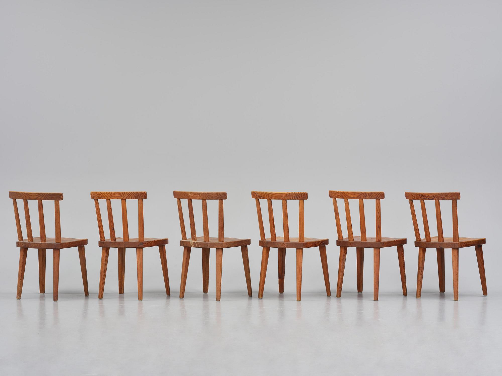 Axel Einar Hjorth, a set of six stained pine "Utö" chairs, Nordiska Kompaniet, Sweden, 1930s.