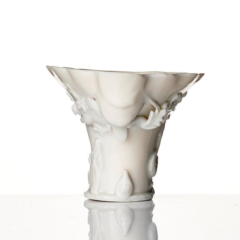 A blanc de chine rhinoceros libation cup, Qing dynasty, Kangxi (1662-1722).