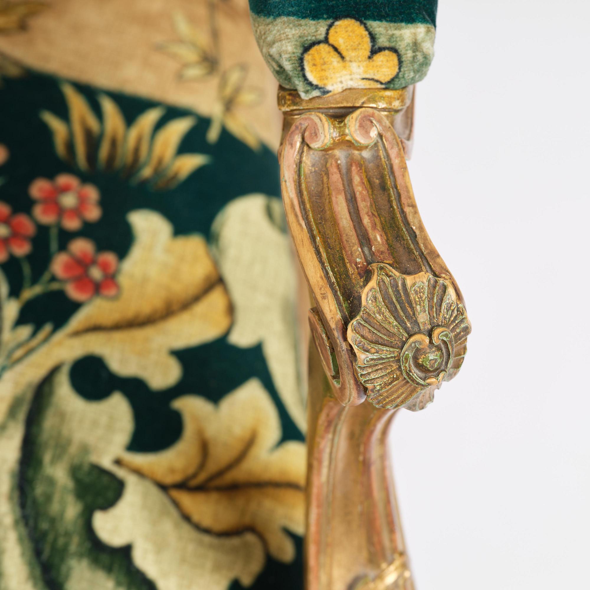 A pair of Louis XV-style giltwood fauteuils, late 19th century.