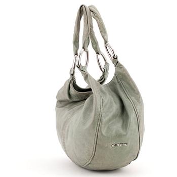 MIU MIU, a green leather shoulder bag.