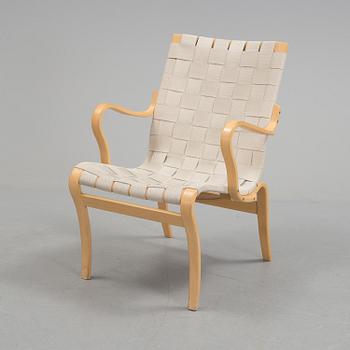 An "Mina" armchair by Bruno Matsson.