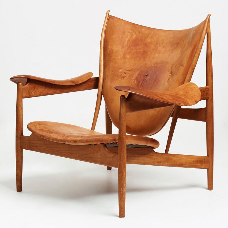 Finn Juhl, a teak and natural brown leather "Chieftain Chair" by Niels Vodder, 1950-60's.