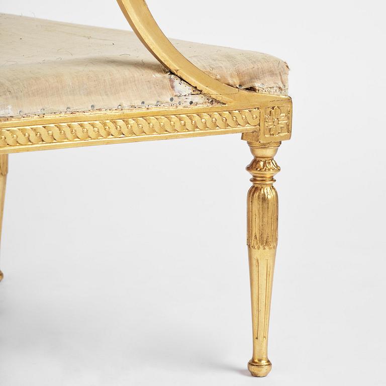 A pair of late Gustavian giltwood open-back armchairs, Stockholm, late 18th century.