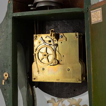 A rokoko style table clock. Pendulum and two keys. 19/20th century.