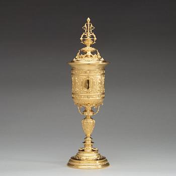 An English early 20th century silver-gilt cup and cover, mark of Goldsmith & Silversmith Co., London 1909.