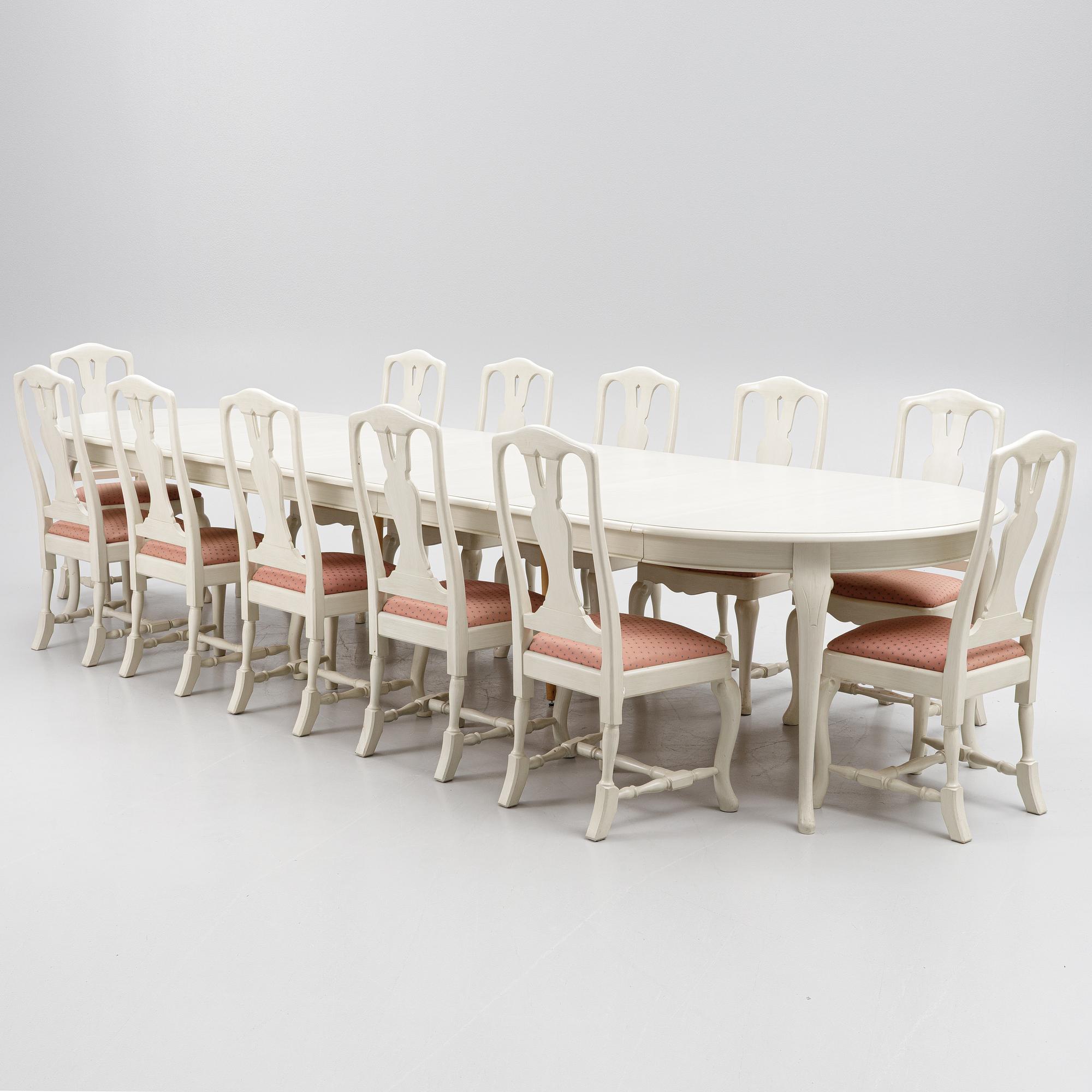 A Rococo style dining table and twelve chairs, KA Roos, Helsingborg, modern production.