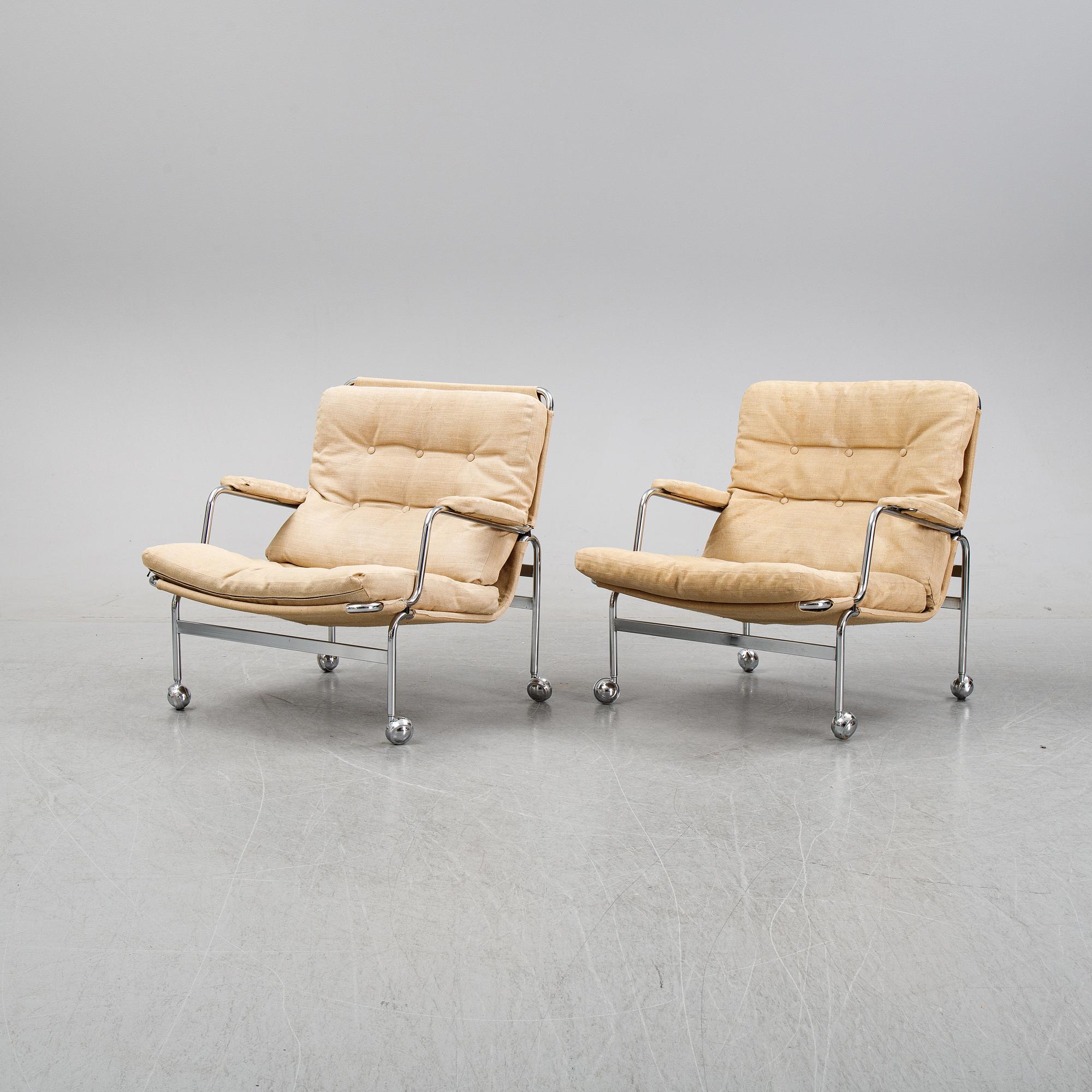 Bruno Mathsson, a pair of easy chairs and a coffee table, 'Karin', Dux, second half of the 20th Century.