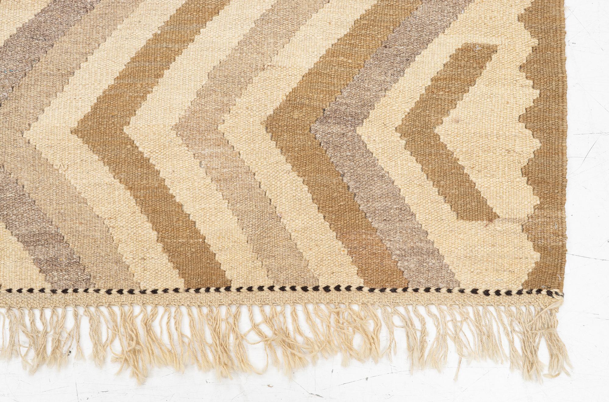 A Kelim rug, c. 229 x 187 cm.