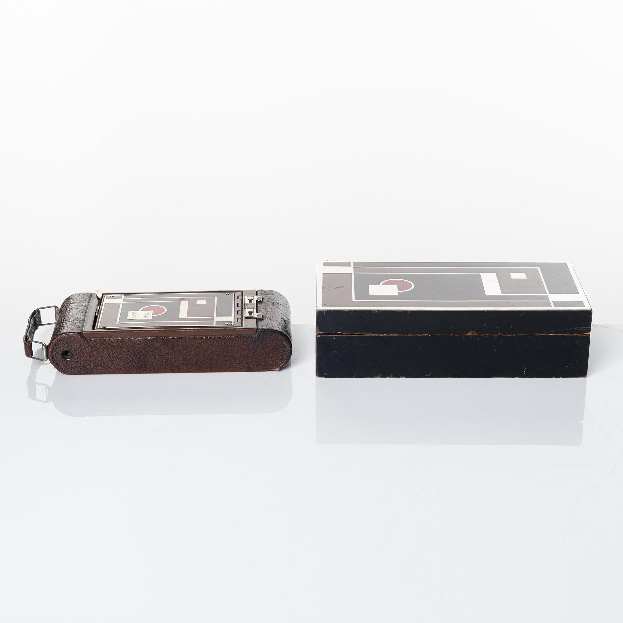 Walter Dorwin Teague, a folding camera in in a lacquered case, USA 1930s.