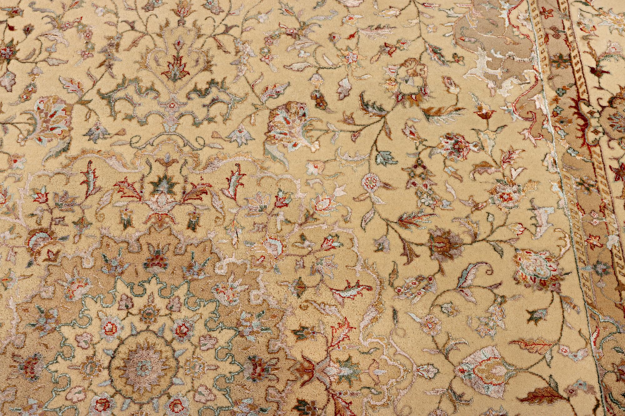 A Tabriz carpet, part silk, c. 311 x 199 cm.