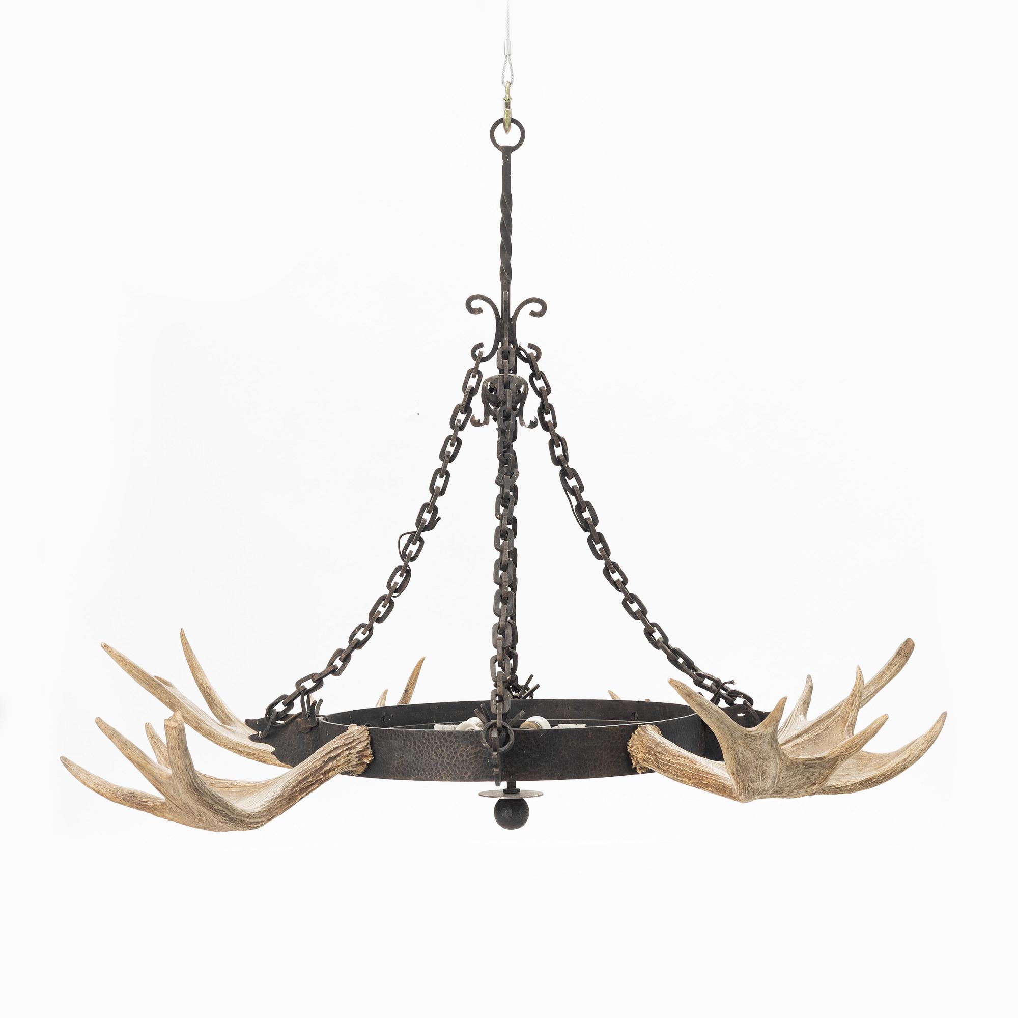 A moose horn and cast iron chandelier from around 1900.