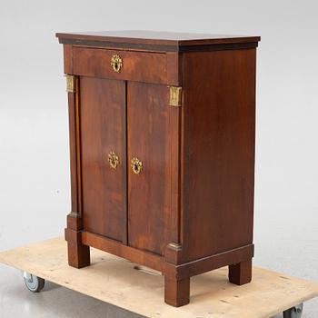 An Empire cabinet, first half of the 20th Century.