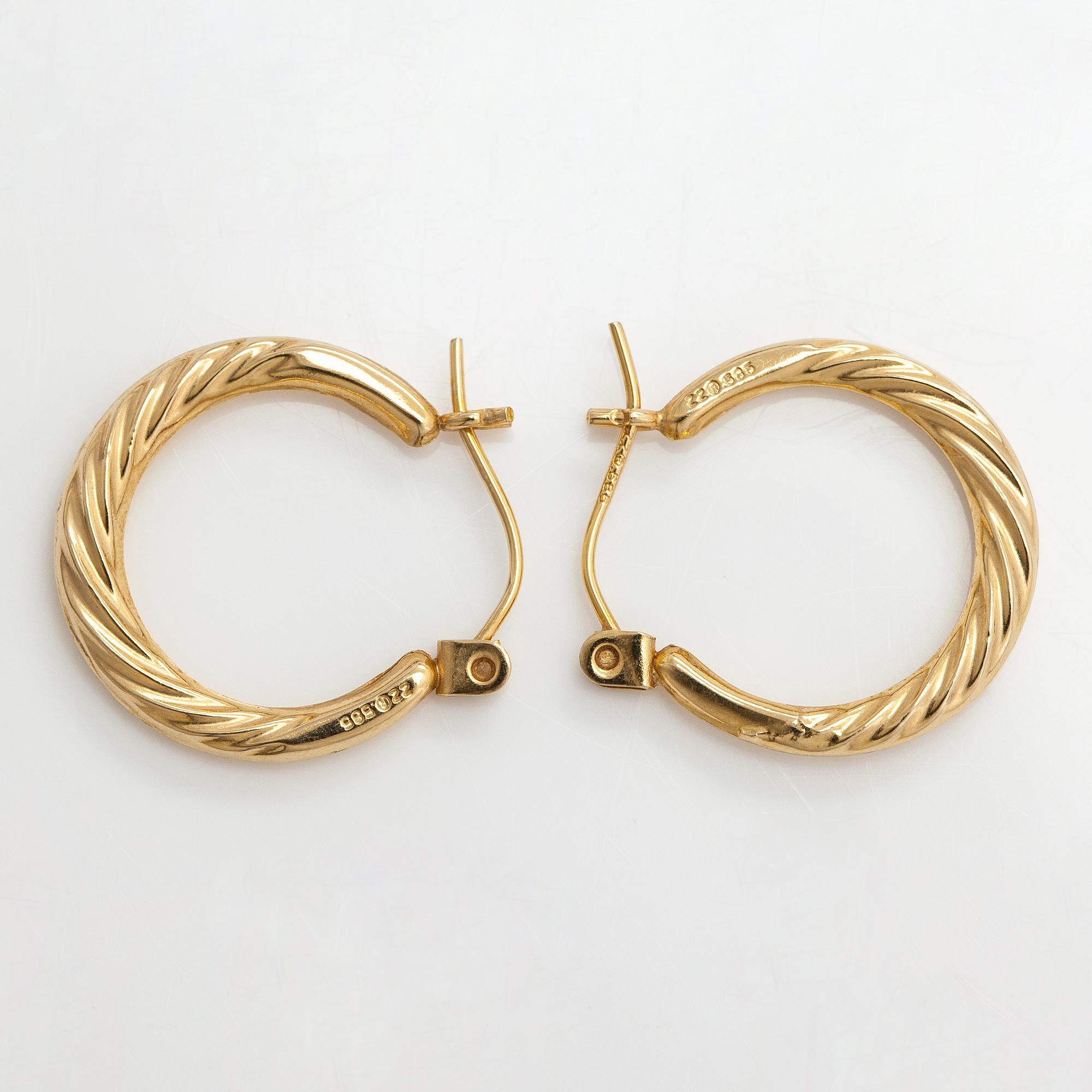 A pair of 14K gold earrings.