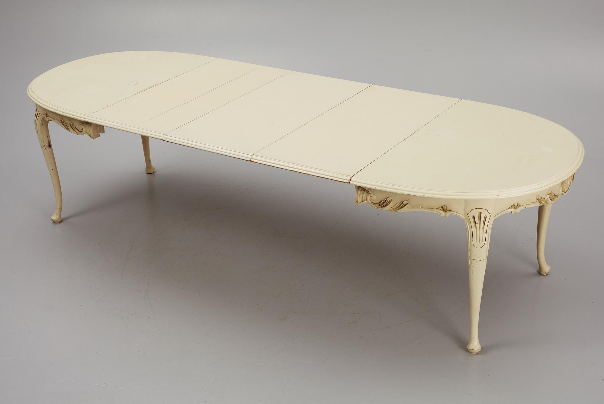 A Rococo style Dining Table with Chairs, first half of the 20th Century.