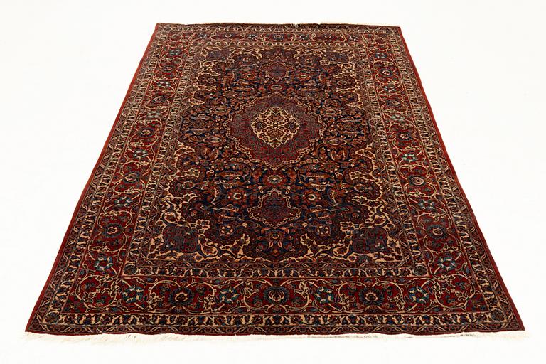A semi-antique Isfahan rug, central Persia, c. 305 x 205 cm.