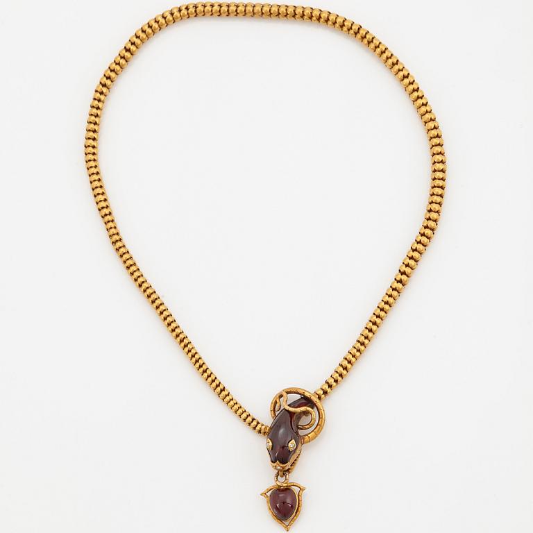 A 14K gold necklace set with garnets and rose-cut diamonds.