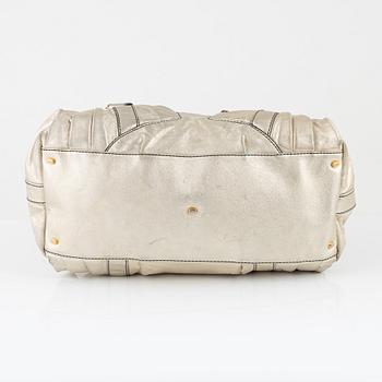 Valentino Garavani, A metallic leather bag.