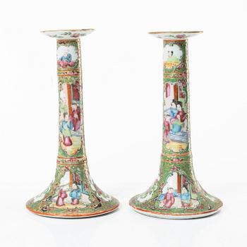 A pair of famille rose Canton candle sticks, Qing dynasty, 19th century.