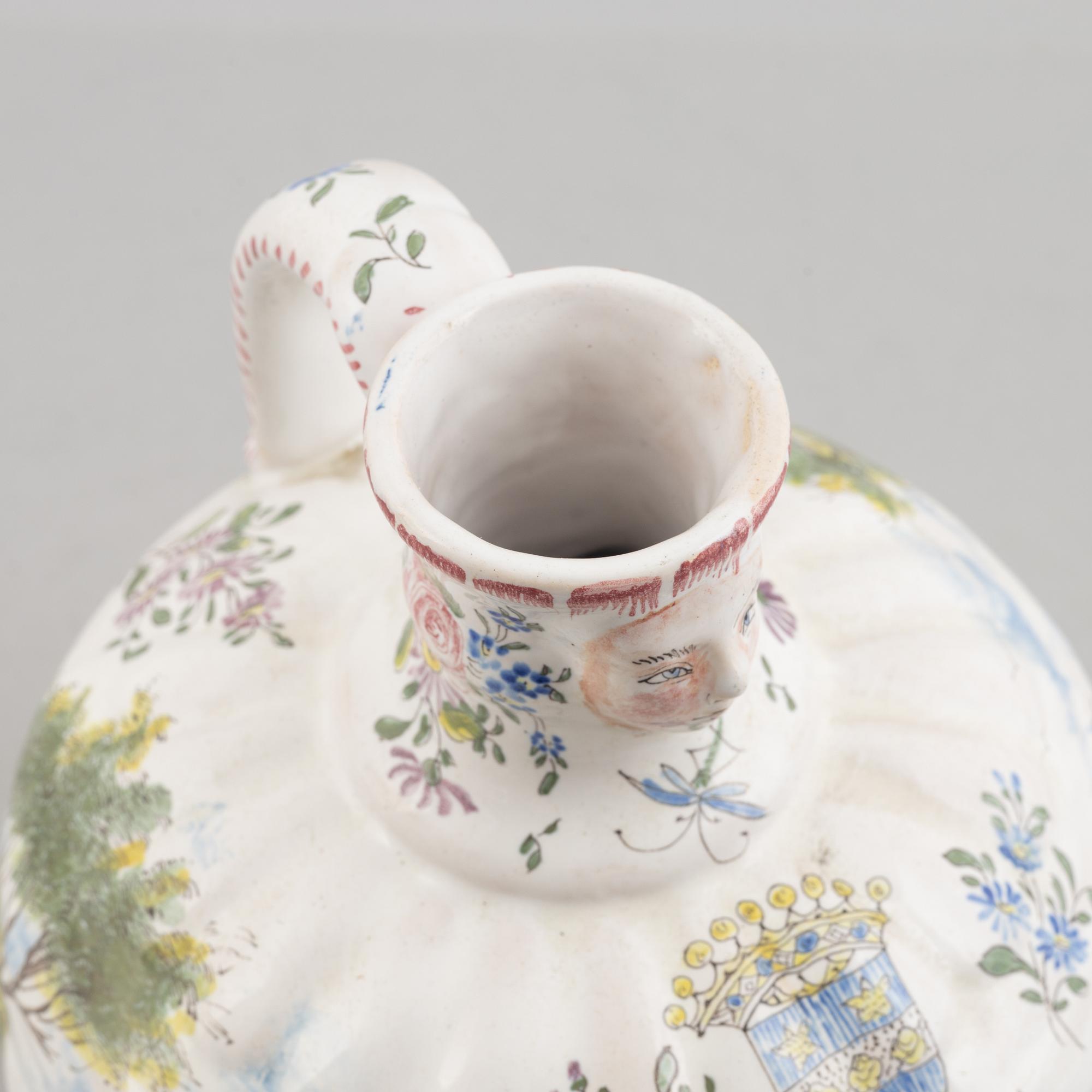 An earthenware historic style jug, end of the 20th century.