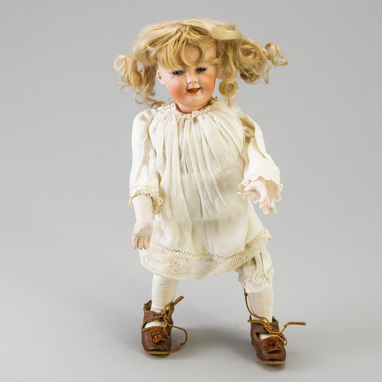 A mechanical bisque head doll by Heubach, probably 7669, Germany, c. 1912.