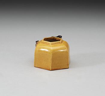 A yellow and brown glazed brush washer with curling dragon, Qing dynasty, 19th Century, with Xuande four character mark.
