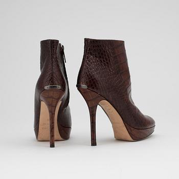 CHRISTIAN DIOR, a pair of brown leather boots.