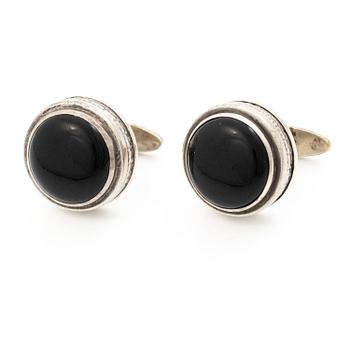 Cufflinks, a pair in silver with cabochon-cut stones.