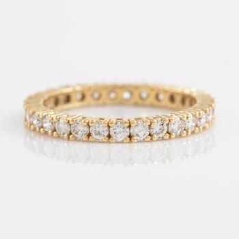 Brilliant cut diamond eternity ring.