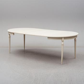Four chairs with dinner table, late 20th Century.