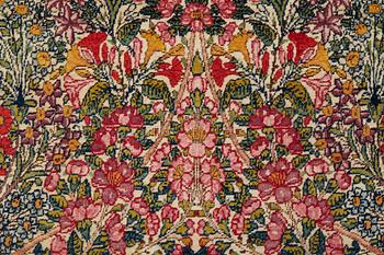 A RUG, a semi-antique Kerman "mille-fleur", ca 198,5 x 136,5 cm.