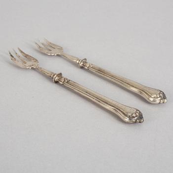 A set of twelve French 19th century silver oyster forks, mark of Hippolyte Thomas, Paris.