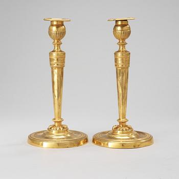 A pair of French Empire early 19th Century candlesticks.