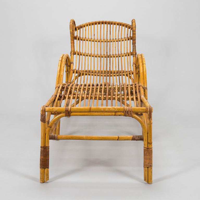 A mid-20th century rattan lounge chair.